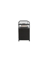 Black wicker outdoor bar cart with steel top, ice bucket, locking wheels, and side basket