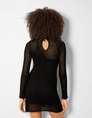 Robe courte manches longues col montant ajours