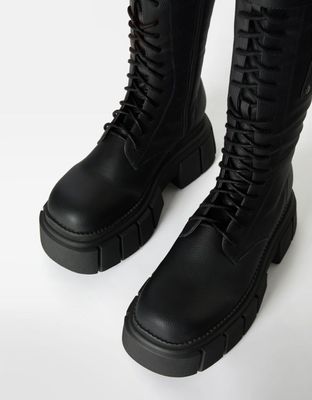 Bottes à lacets crantées avec poche