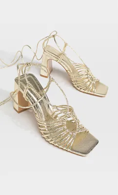 Sandales à talon dorées avec nœud