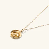 Courage: Evil Eye Coin Pendant : Handcrafted in 14k Gold | Mejuri