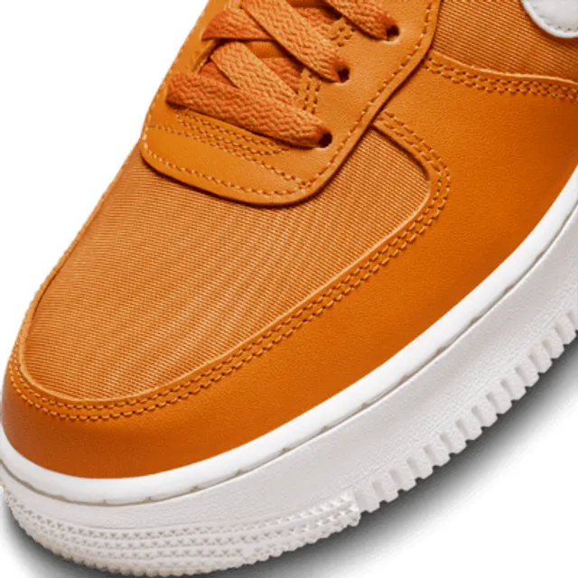 Nike Air Force 1 '07 ESS sneakers in white and orange