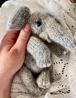 Newborn baby elephant in overalls