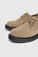 Chaussures croûte de cuir volume