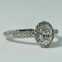 14kt Gold 1.00ctw Oval Diamond Halo Engagement Ring Set