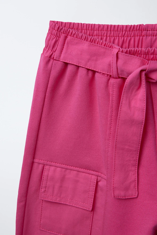 PANTALON JAMBES LARGES EN MATIÈRES VARIÉES AVEC POCHES