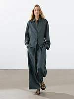 Flowing creased-effect trousers