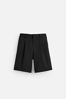 TEXTURED PLEATED SHORTS
