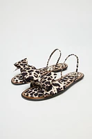 ANIMAL PRINT BOW FLAT SANDALS