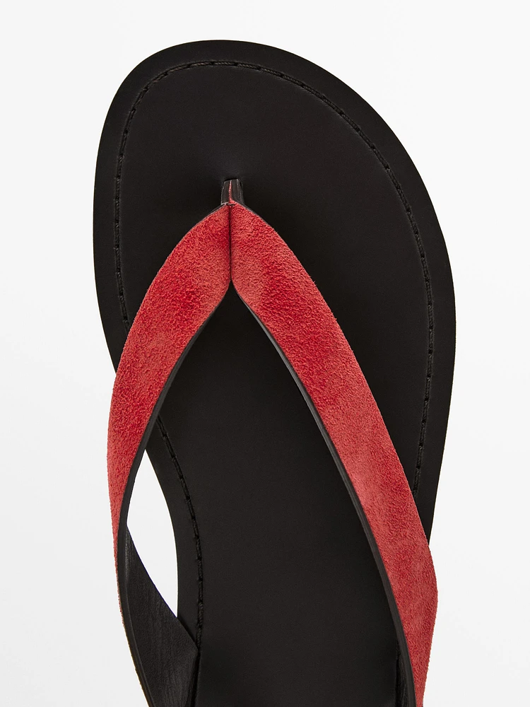 Split suede sandals with toe divider