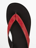 Split suede sandals with toe divider