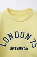 RAISED TEXT SWEATSHIRT