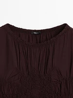 Flowing blouse with gathered detail