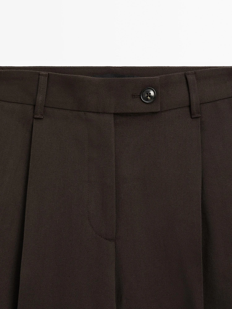 Wide-leg pleated cotton blend trousers
