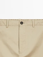 Trousers with patch pocket
