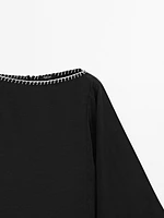 Cape blouse with batwing sleeves