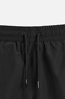 BASIC LONG SWIM TRUNKS