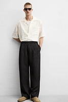 FLOWY PLEATED PANTS