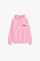 SWEAT À CAPUCHE IMPRIMÉ