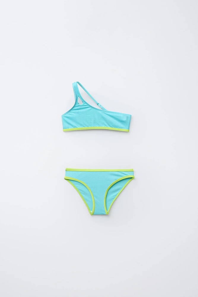 6-14 ANS/ MAILLOT DE BAIN ASYMÉTRIQUE BRILLANT LISERÉS