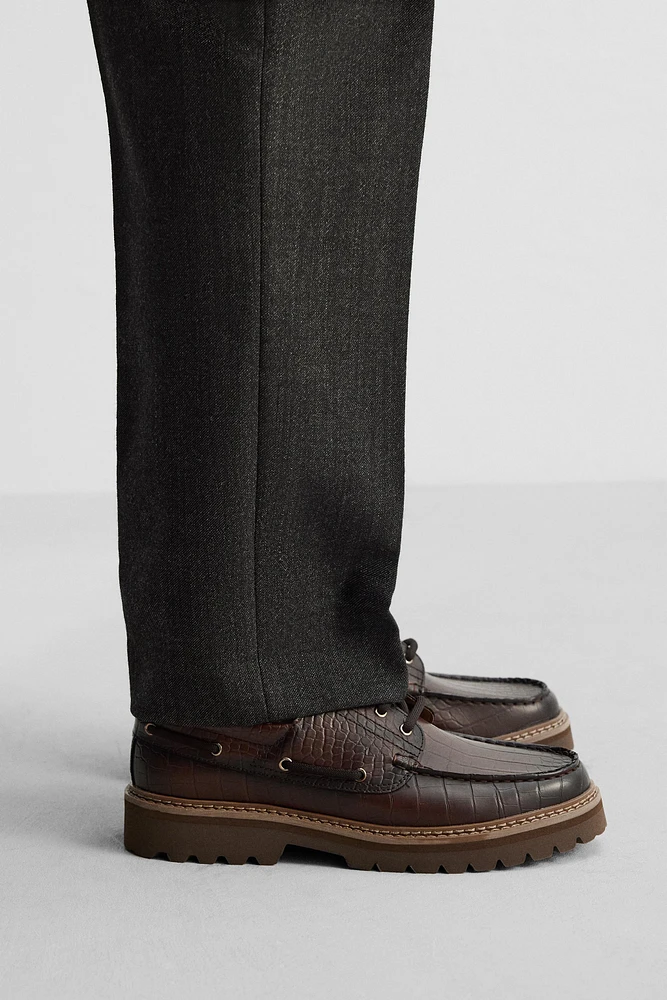 EMBOSSED BOAT SHOES