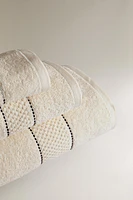 SERVIETTE DE BAIN BORDURE SURPIQÛRES