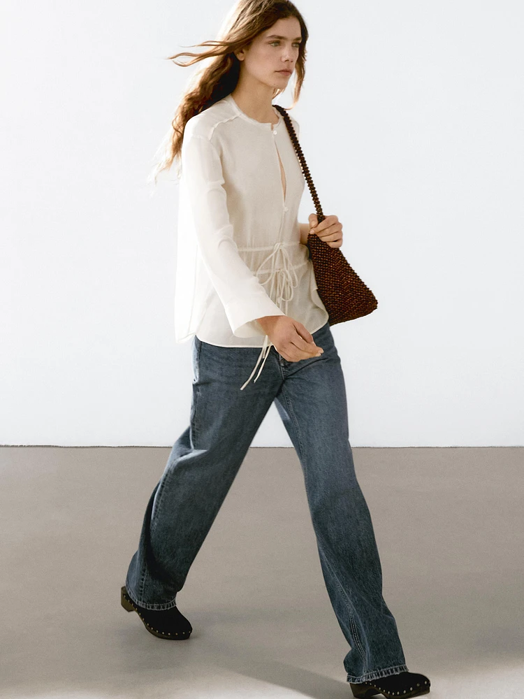 Flowing semi-sheer blouse with ties