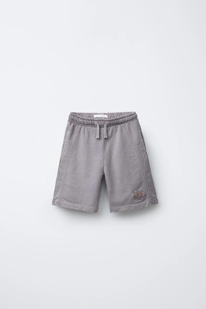 PLUSH SHORTS WITH EMBROIDERED LABEL