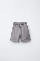 PLUSH SHORTS WITH EMBROIDERED LABEL