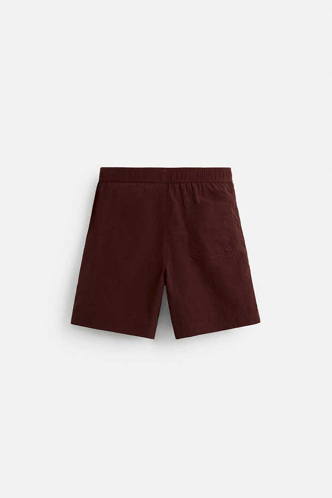 DRAWSTRING SWIM TRUNKS