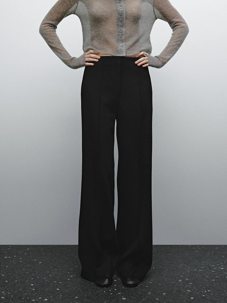 Flared trousers with zip