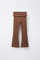 FOLD-OVER WAISTBAND FLARE LEGGINGS WITH EYELETS
