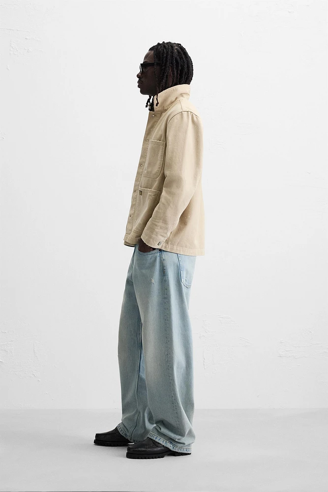 VESTE DÉLAVÉE À ÉCLABOUSSURES