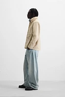 VESTE DÉLAVÉE À ÉCLABOUSSURES