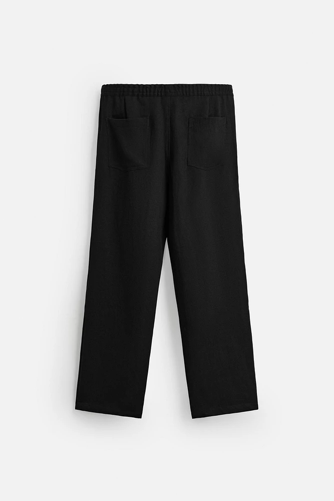 FLOWY PLEATED PANTS