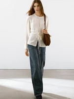 Flowing semi-sheer blouse with ties