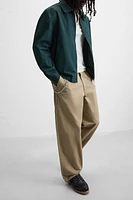 PANTALON RELAXED FIT À PLIS