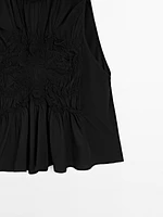 Flowing halter top with gathered detail
