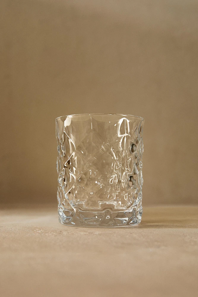 CRYSTALLINE TUMBLER WITH RAISED DESIGN