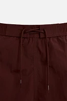 DRAWSTRING SWIM TRUNKS
