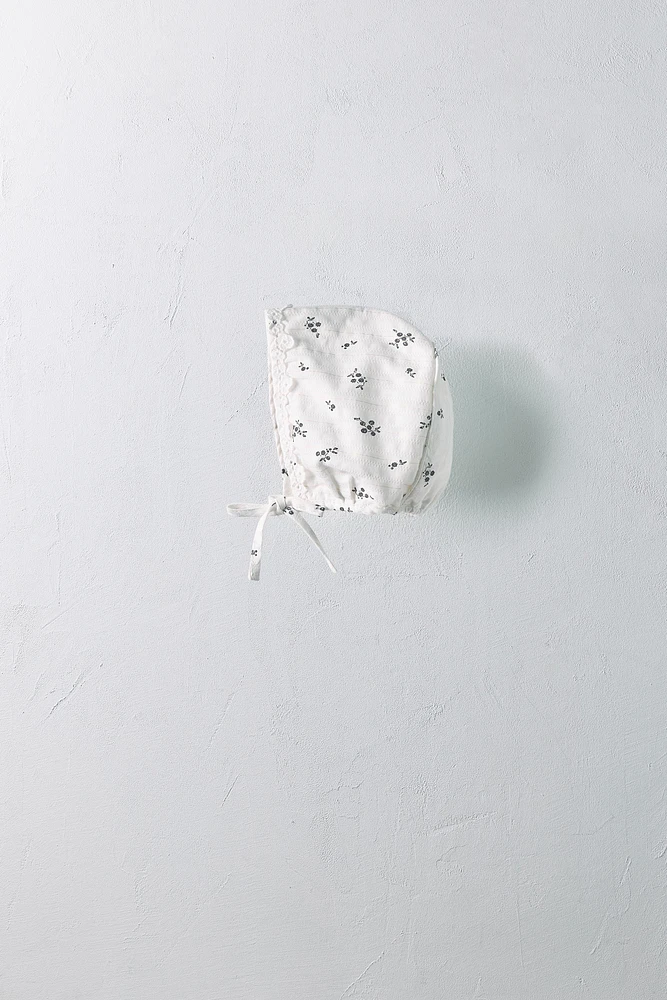 0-18 MONTHS/ SHINY FLORAL BONNET LIMITED EDITION