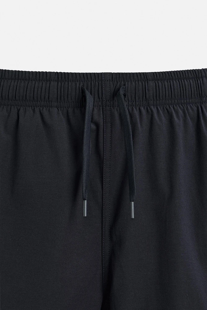 MAILLOT DE BAIN LONG À BANDES CARREAUX