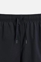 MAILLOT DE BAIN LONG À BANDES CARREAUX