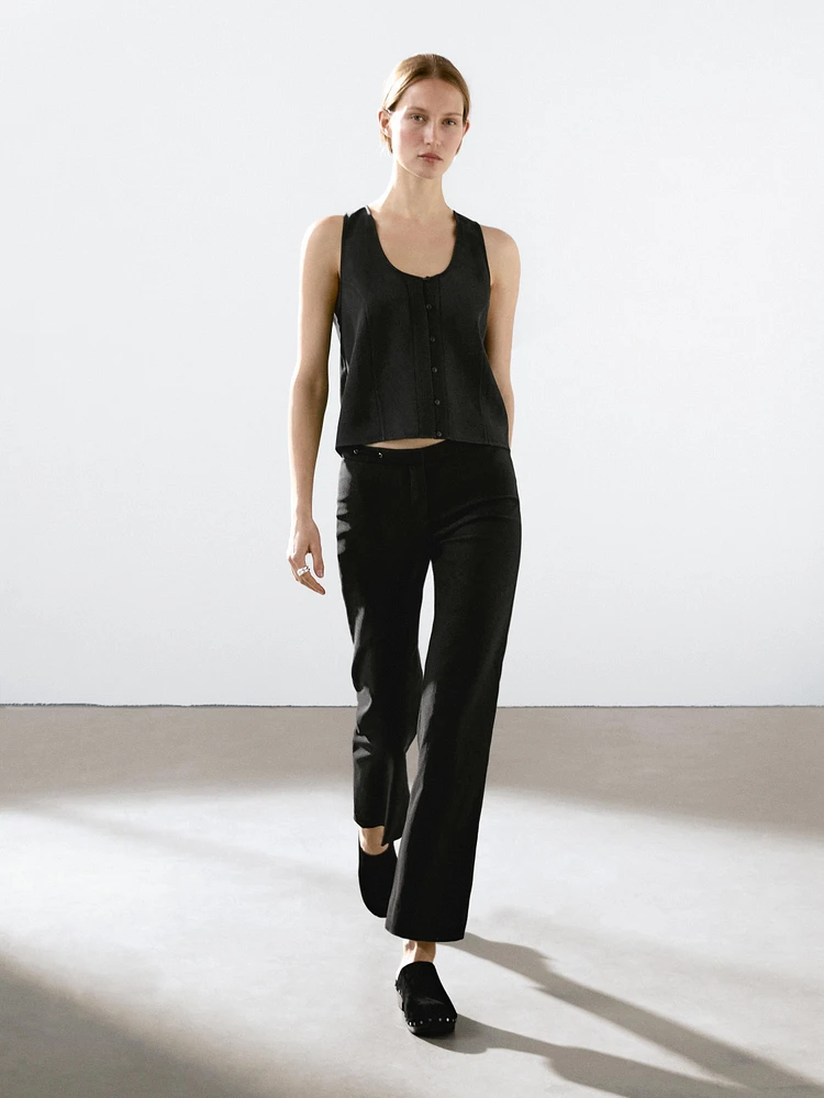 Flared trousers with waist detail