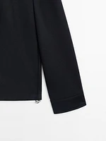 Jacket with adjustable hem detail