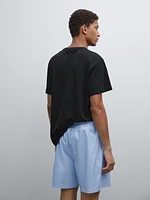 Short sleeve pyjama top and striped trousers