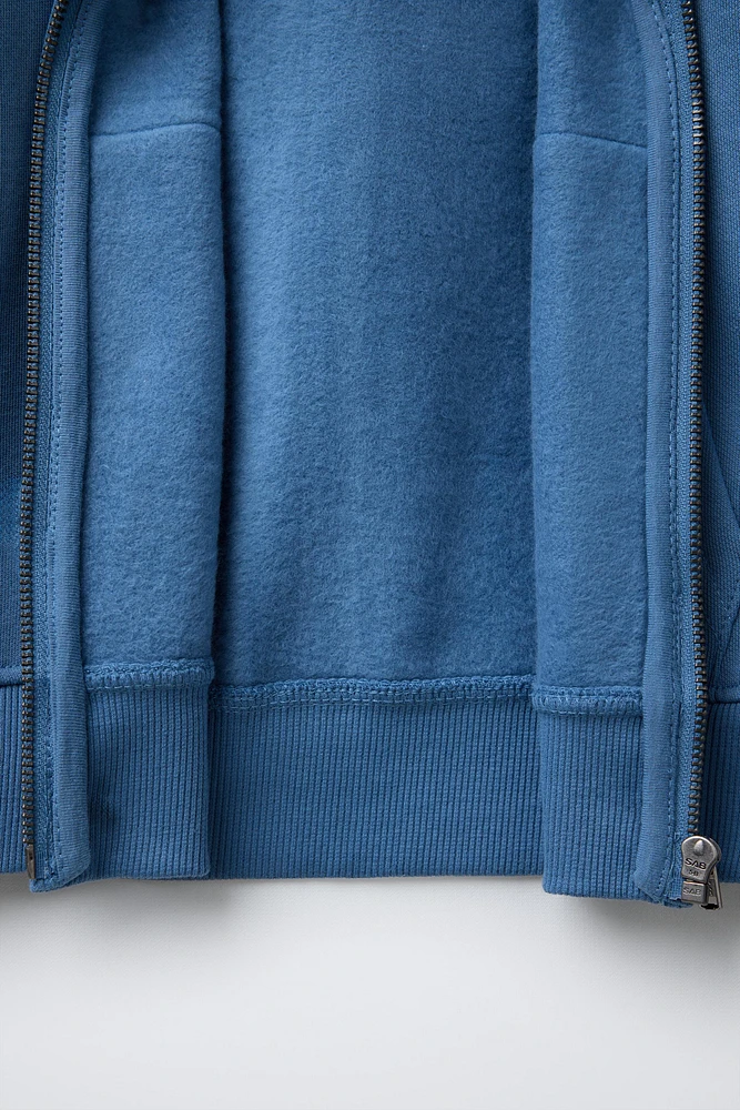 SWEAT À CAPUCHE ZIPPÉ