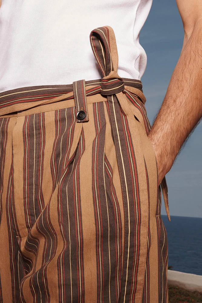 LIMITED EDITION STRIPED BELTED PANTS