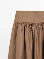 Jupe midi en tissu festonné avec empiècement - Studio