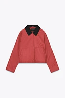 VESTE CIRÉE À COL EN MATIÈRES VARIÉES